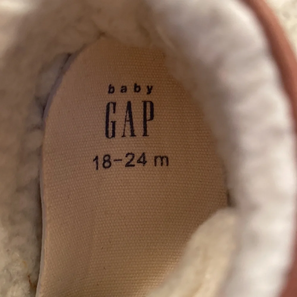 Baby Gap size 18-24 months brown bootie with Sherpa lining. Red laces. Like new